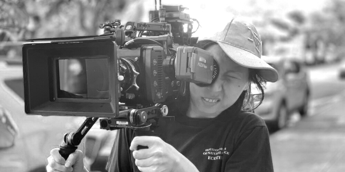 Filmmaker Jingjing Tian holding a camera