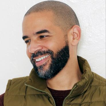 Nathan Yungerberg, a forty-something Black storyteller headshot