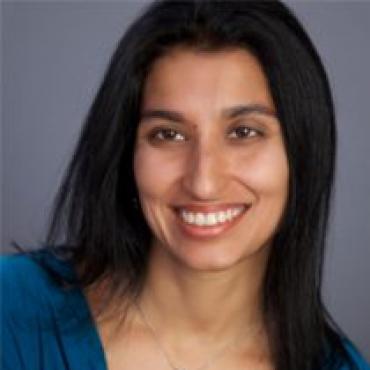 Headshot of Yasmin Mistry smiling at the camera